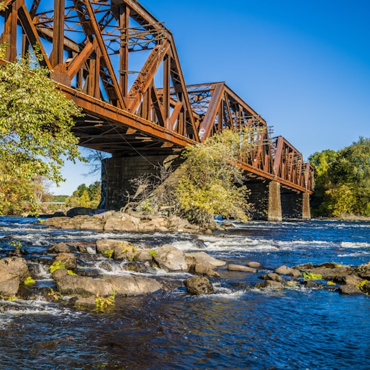 brown bridge on body of water in Bedford United States