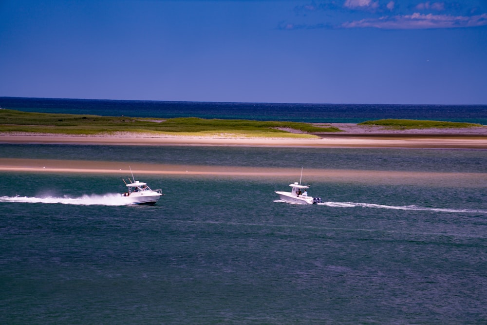 two yachts on body of water