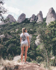 woman standing on rock formation