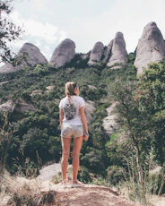 woman standing on rock formation