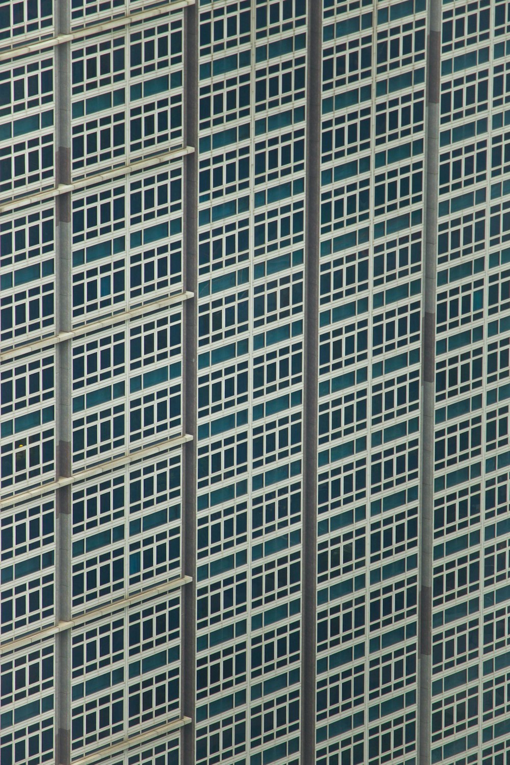 an airplane is flying in front of a building