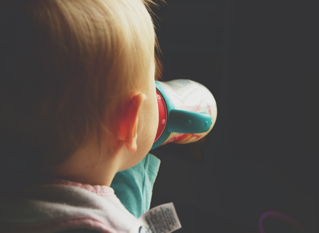 toddler drinking on cup