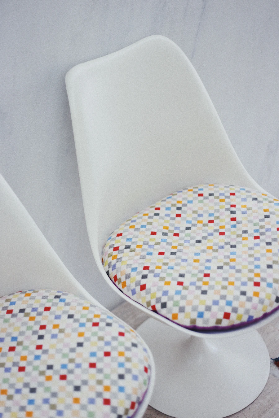 Folded plain white t-shirts stacked on a table