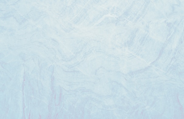 Delicate lavender sprigs laid over cool marble with soft blue-gray undertones