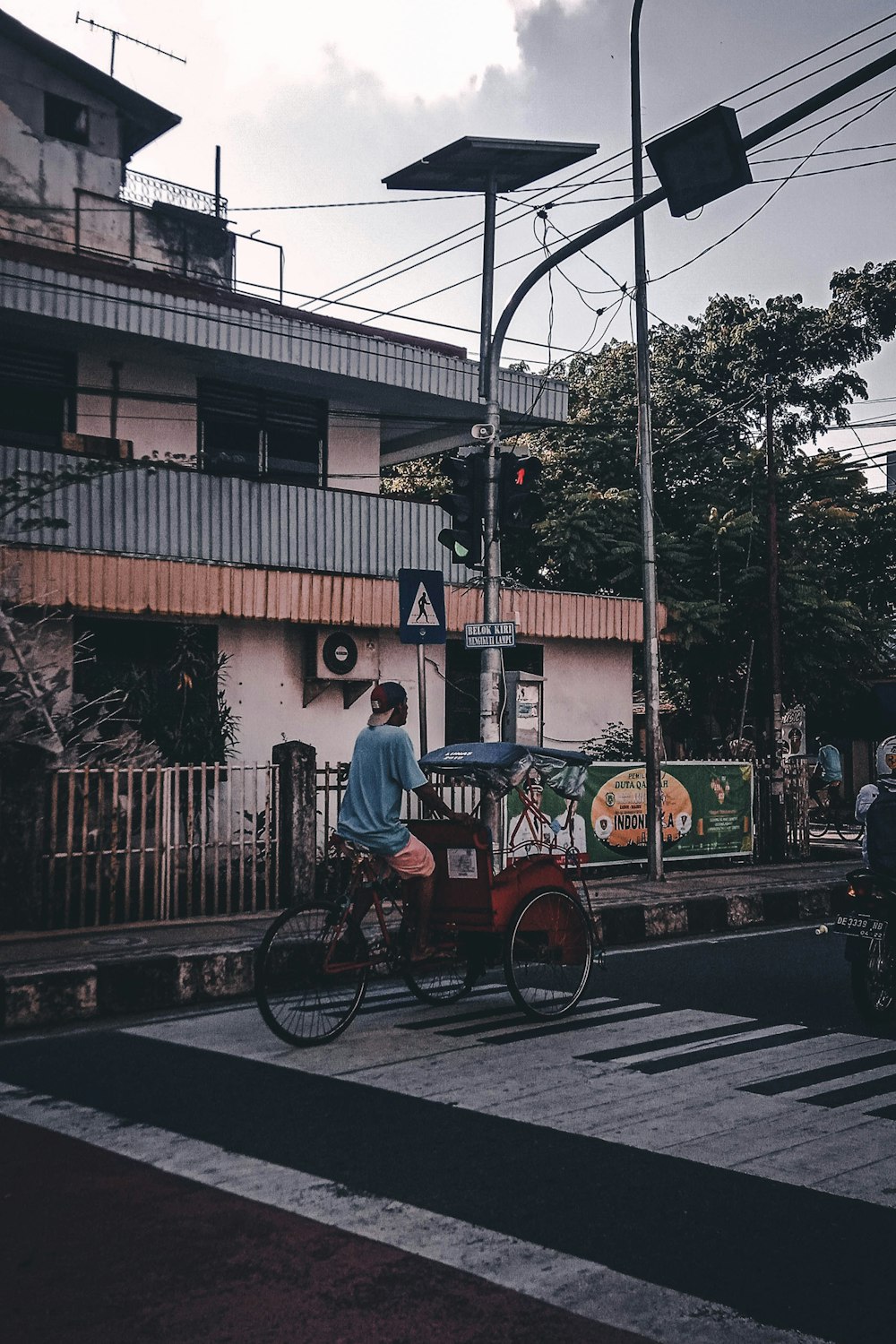 man riding bicycle on road