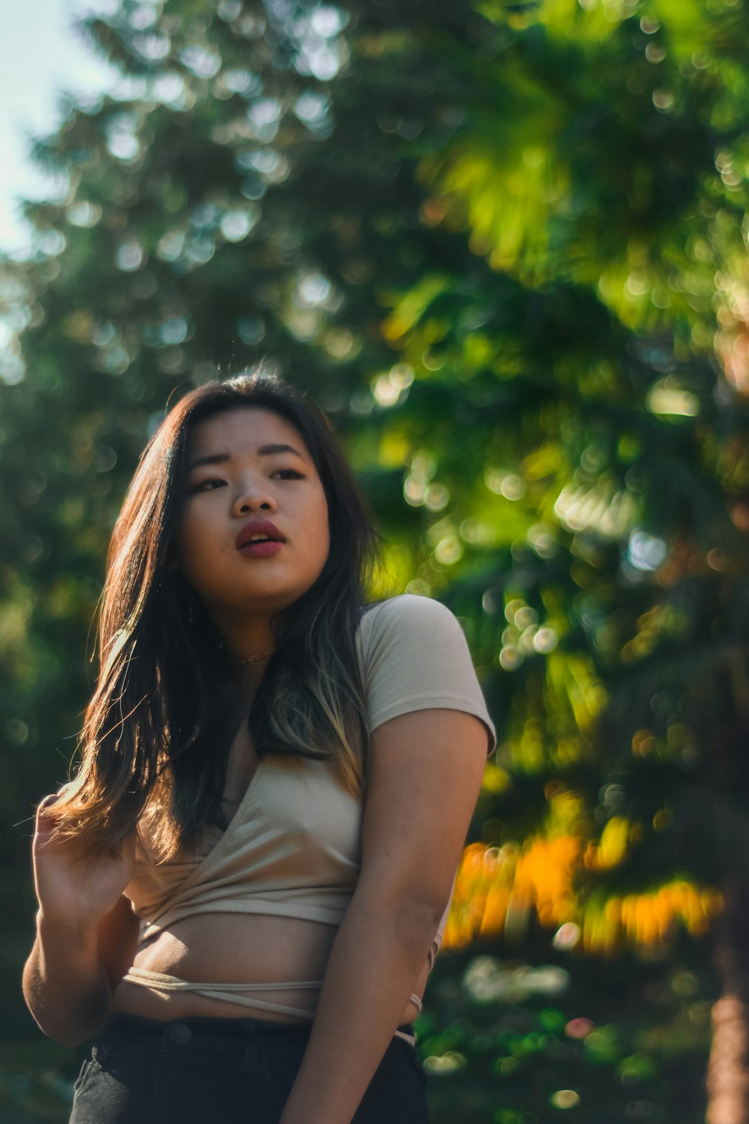 woman standing near tree during daytime