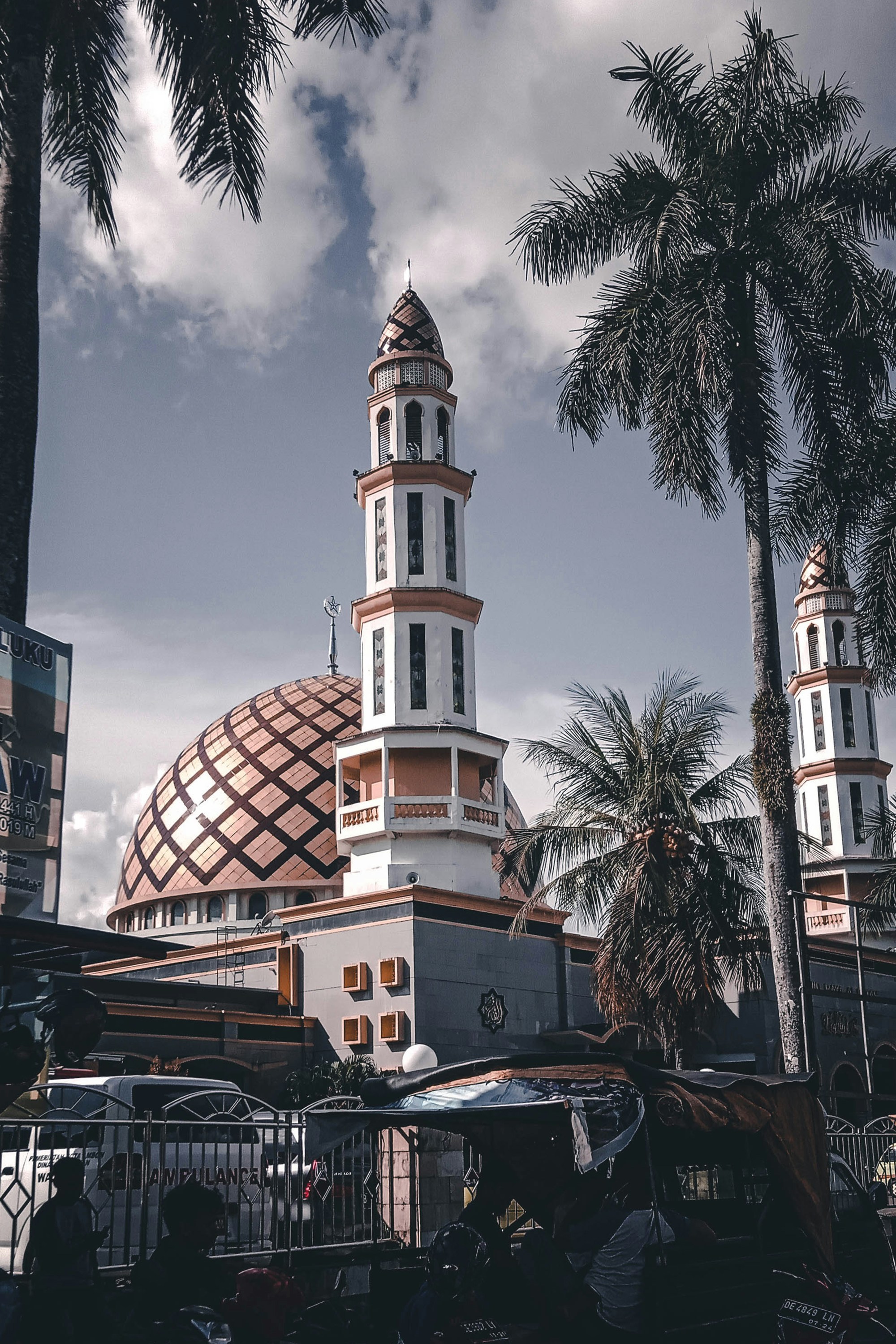 a tall building with a dome and a clock on top