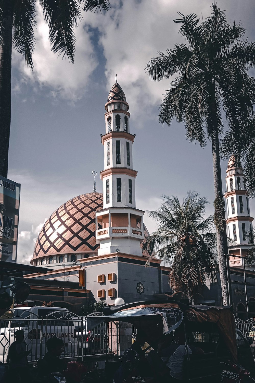 a tall building with a dome and a clock on top