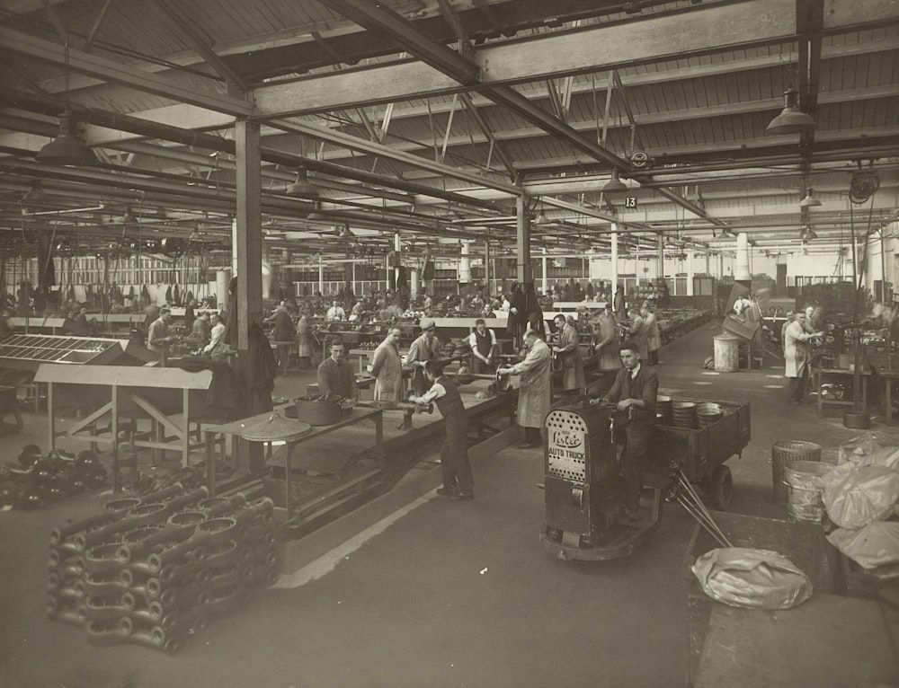 grayscale photo of people in a store