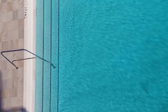 Before and after shots of a pool depth adjustment project.