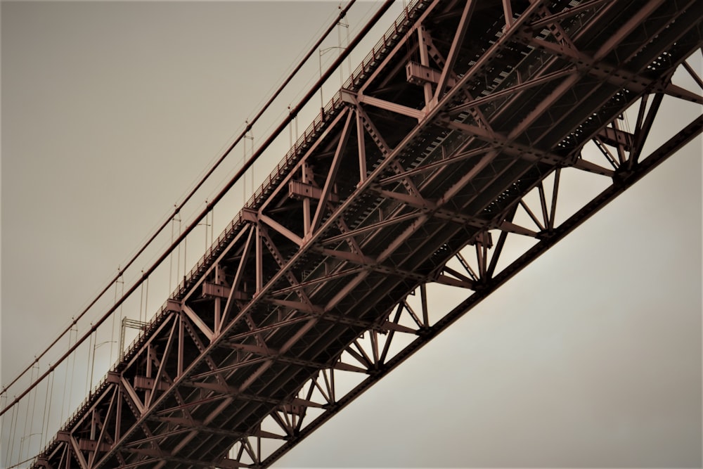 red concrete bridge under gray skies