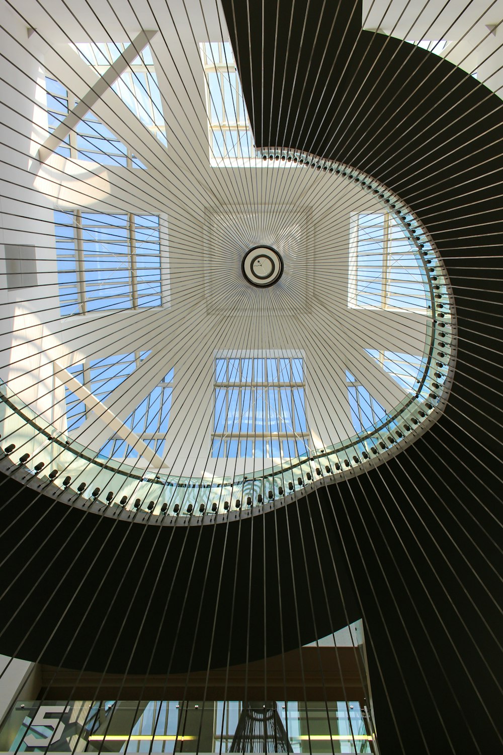 the ceiling of a building with a spiral design