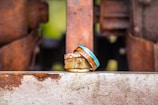 A set of rings stacked artistically on a rustic wooden surface highlighting their craftsmanship.