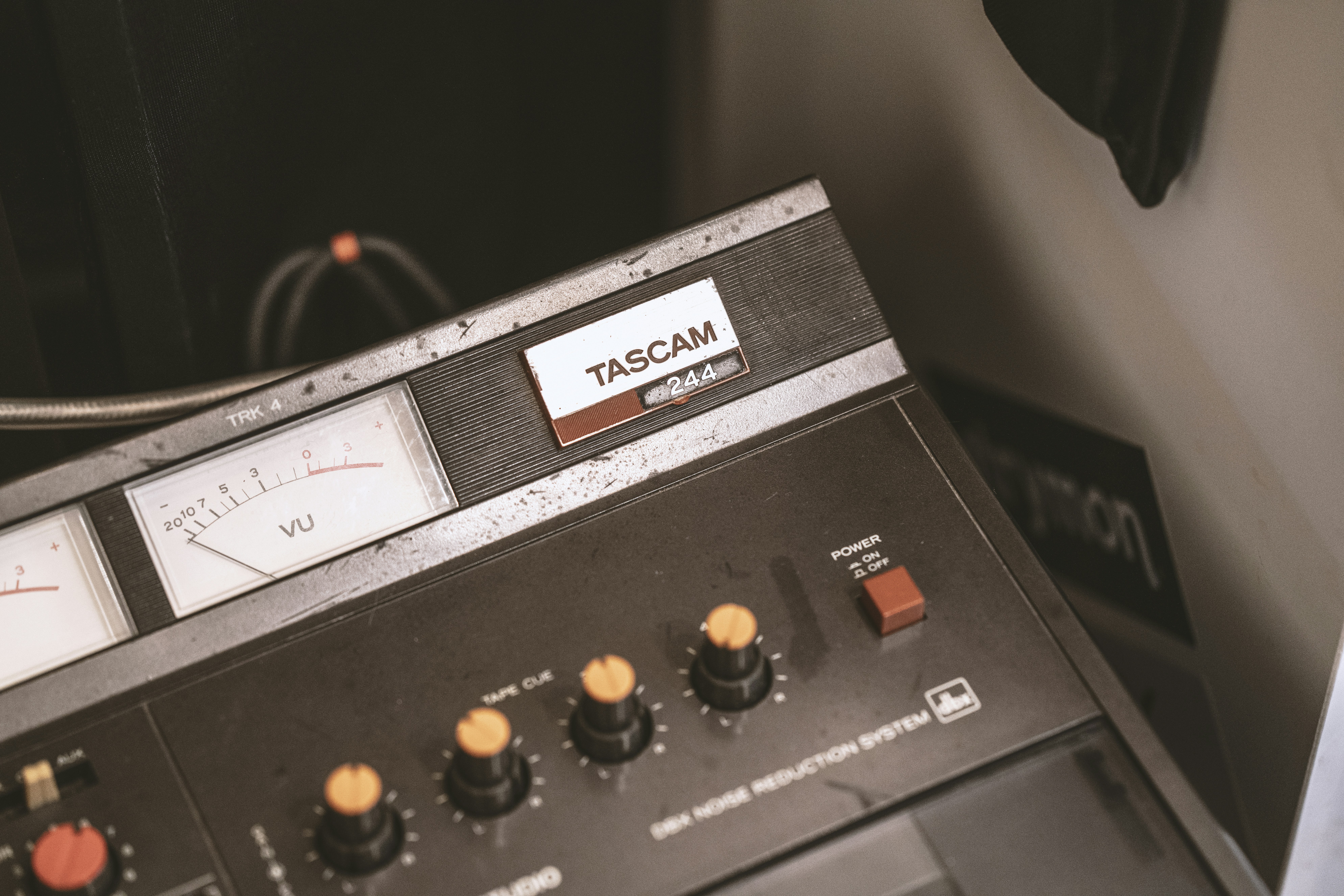 black Tascam electronic component beside wall
