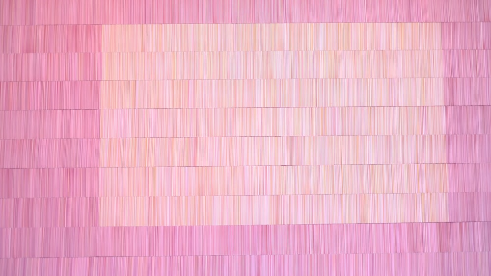 a painting of a pink square on a wall