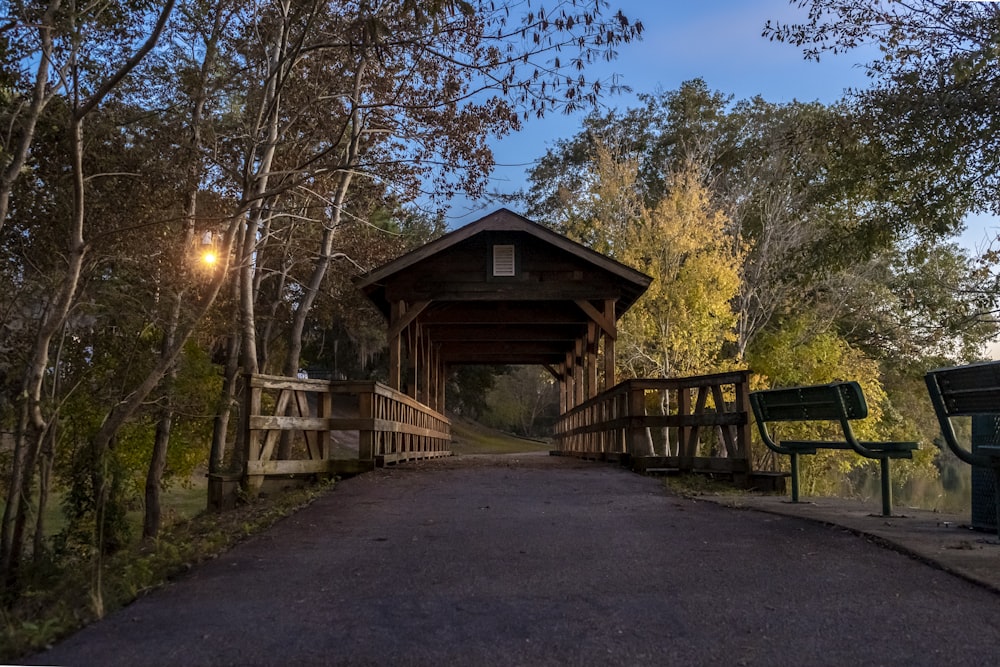 brown wooden bridge with roof