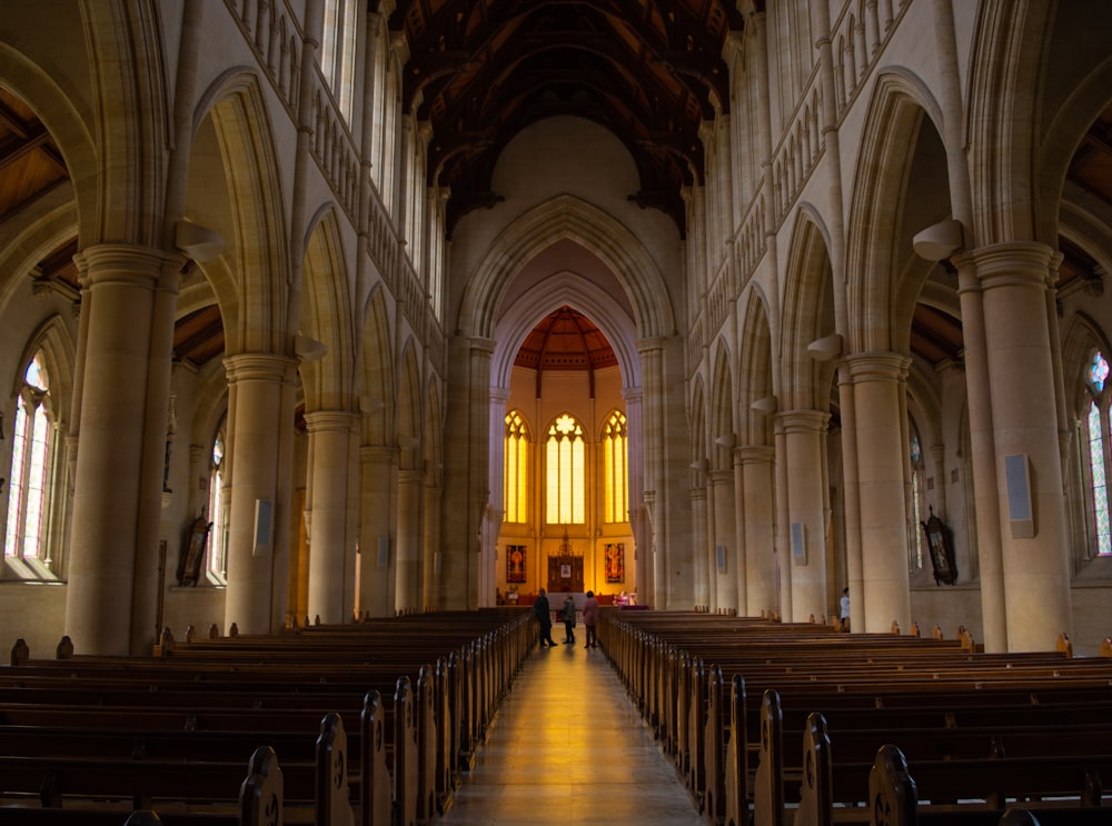 person standing inside yellow and white church