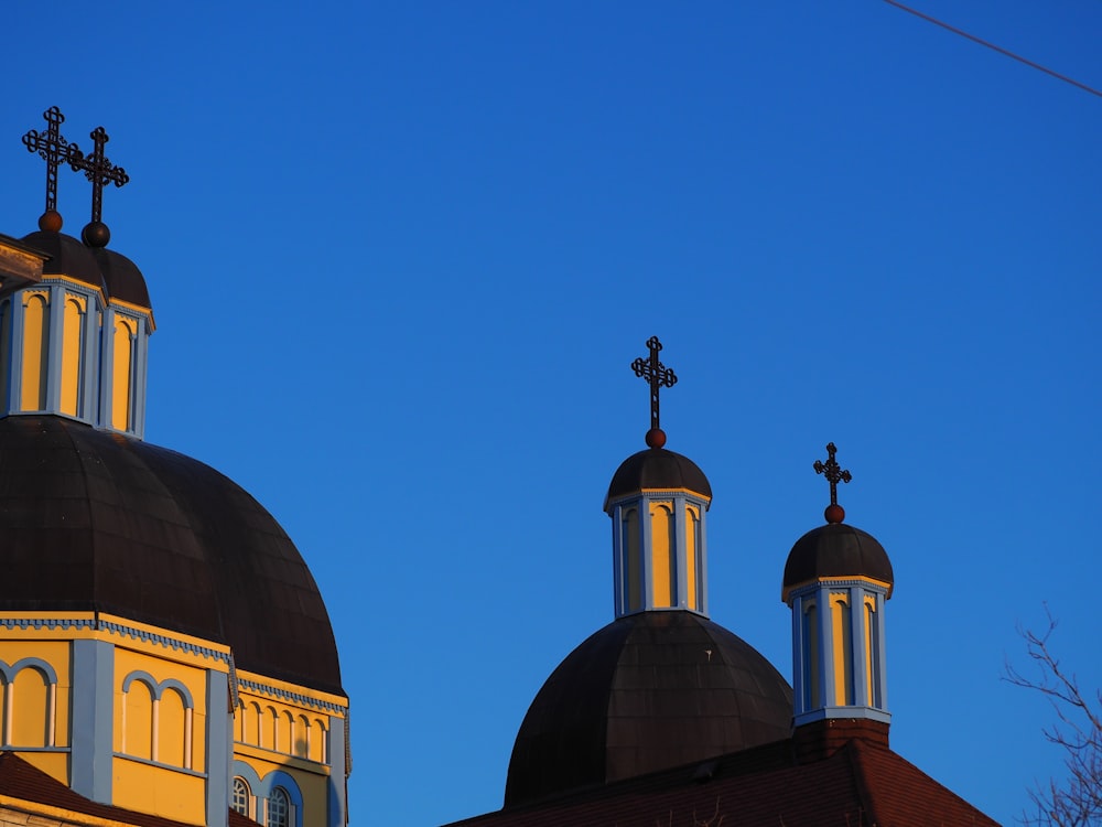 two domes with crosses on top of a building