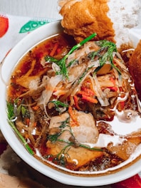 A traditional Russian soup served in a rustic bowl.