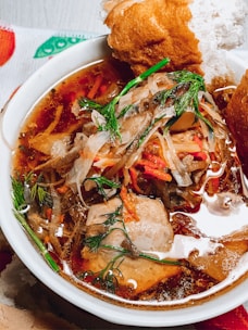 A traditional Russian soup served in a rustic bowl.