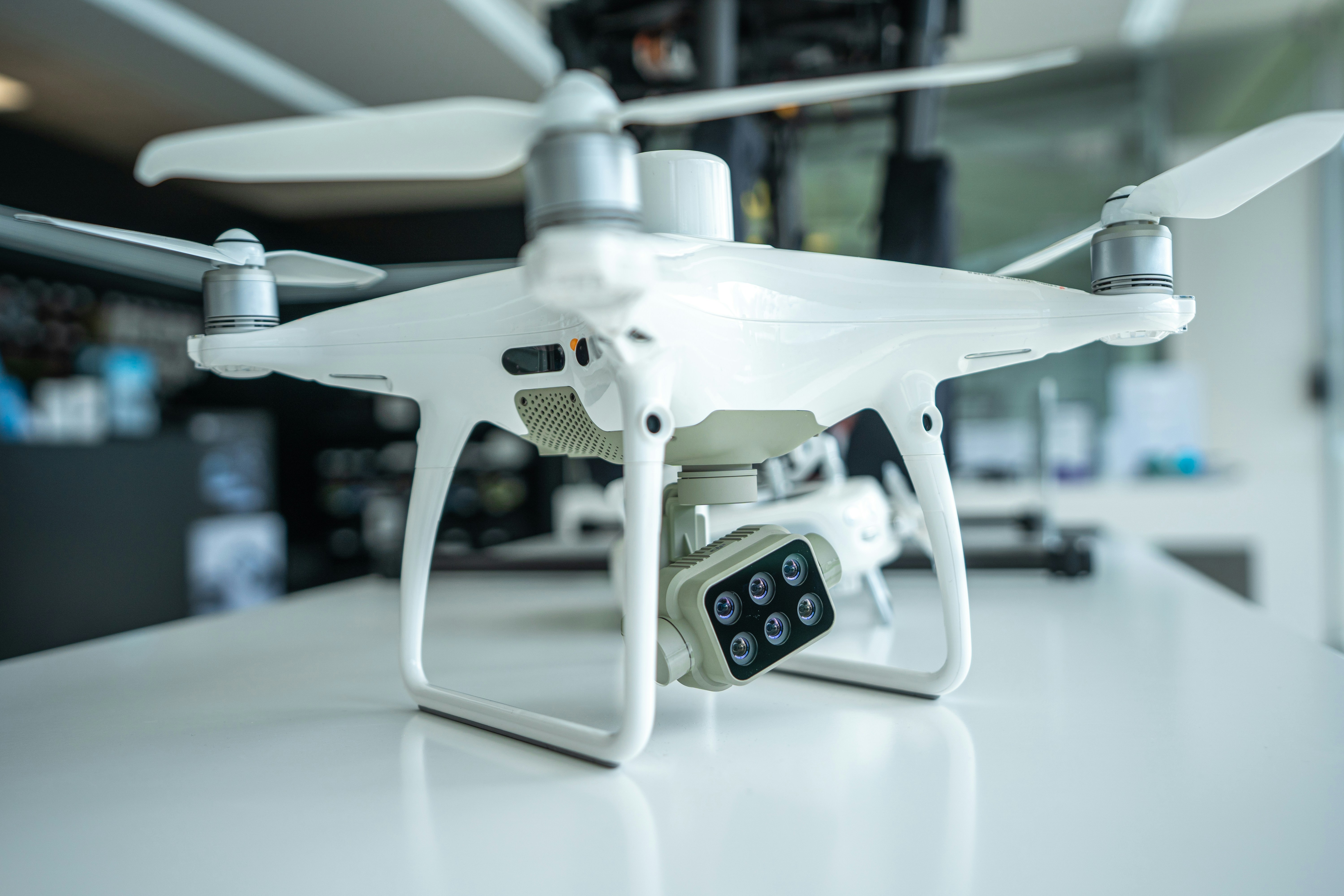 white drone on white surface