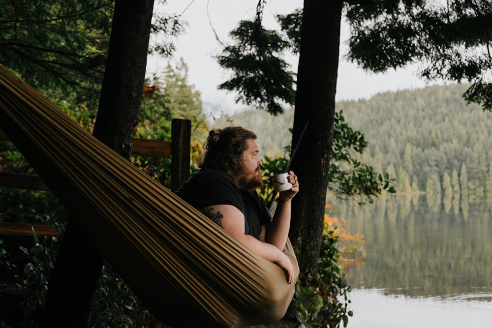 man sitting under tree