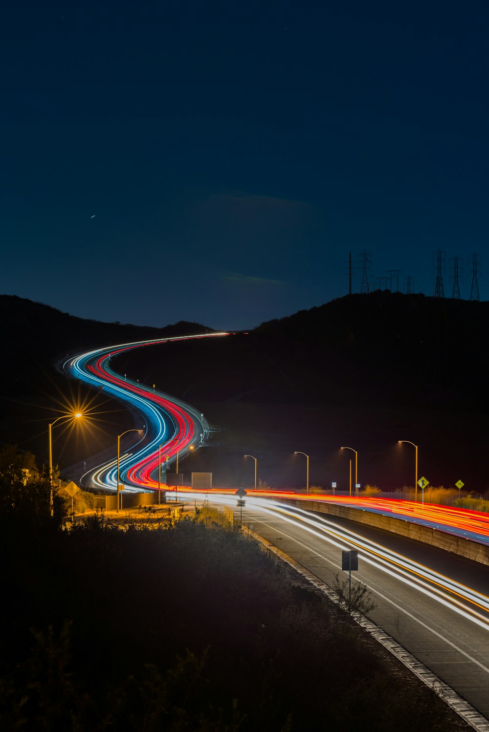 long-exposure photograph of road at night