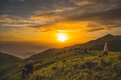 Sunset view over rolling hills where runners pause to reflect and connect.