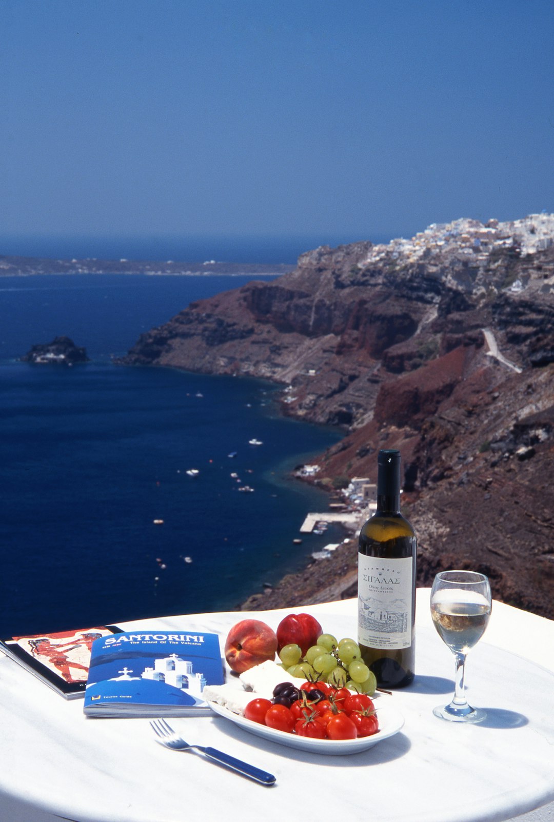 Having lunch over looking the blue sea. Sunny and warm.