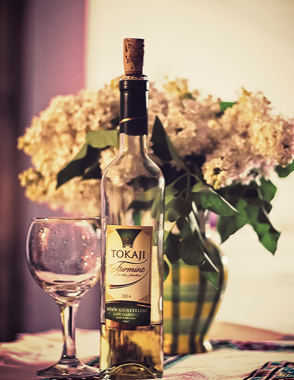 Tokaji bottle beside wine glass