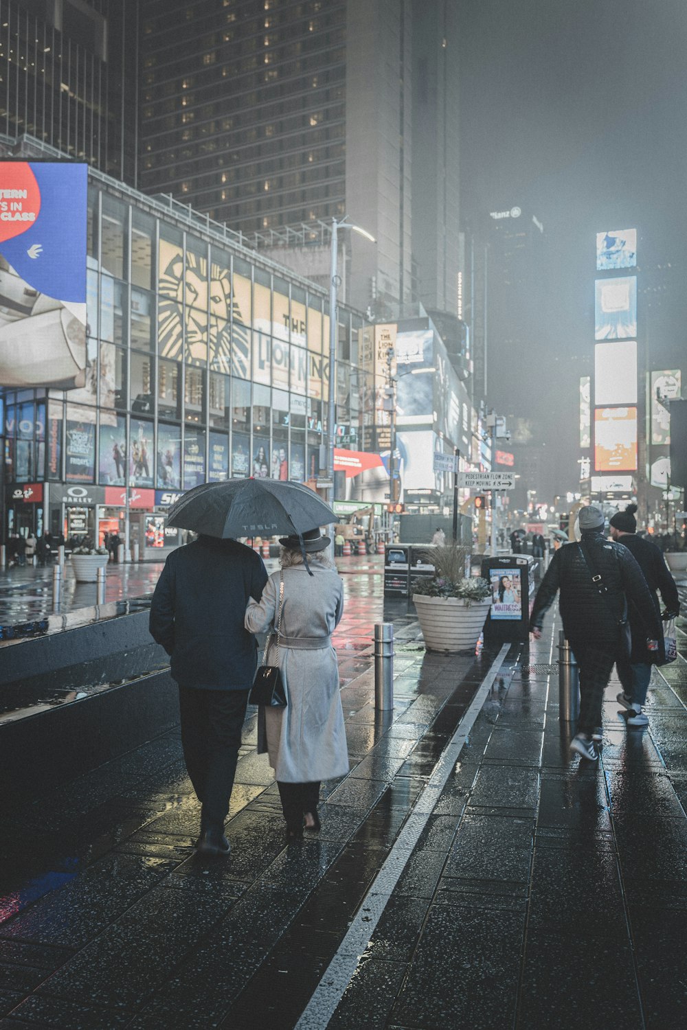 people walking beside buildings