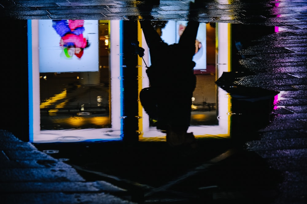 man standing infront of LED signage