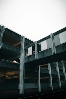 Urban industrial architecture at night with stark concrete and steel