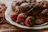 Close-up of natural fermented enzyme bread and colorful gelato scoops on a rustic plate.