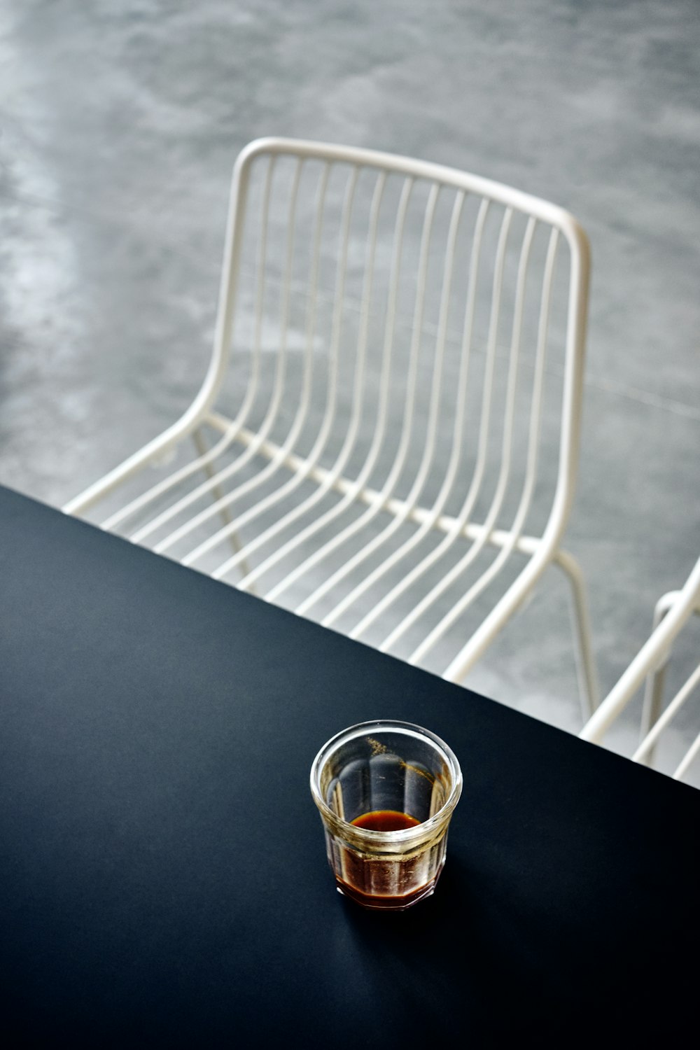 clear cup on black table