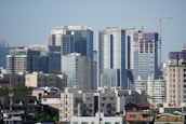 City skyline with high-rise buildings representing real estate investment opportunities.