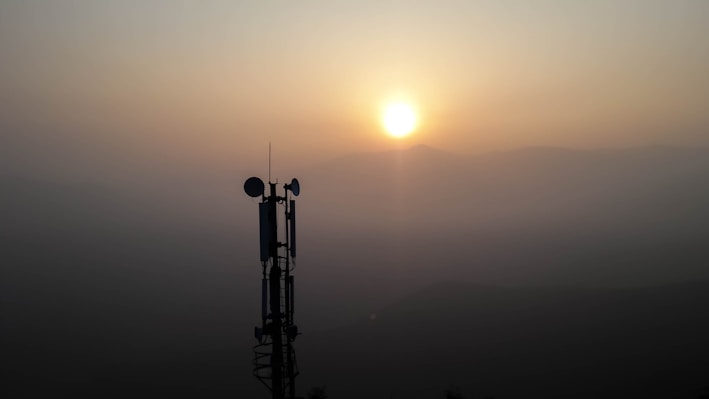 silhouette photo of transmission post