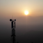 silhouette photo of transmission post
