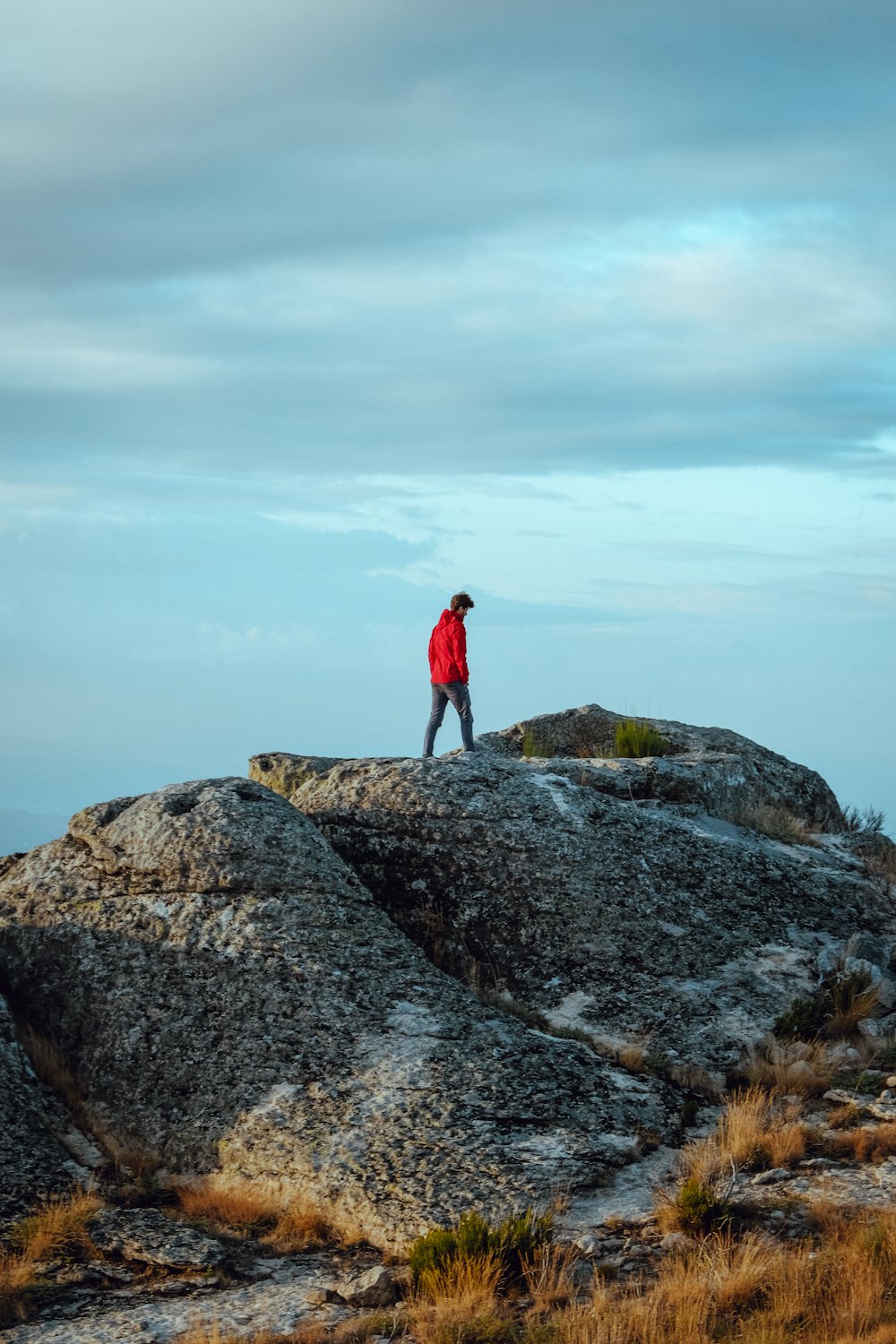 man standing on rock formation