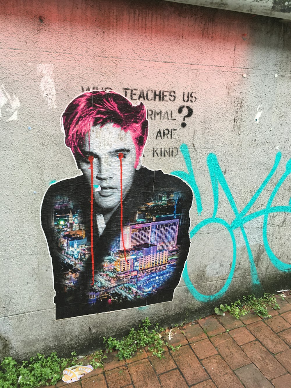 graffiti of man on gray concrete wall