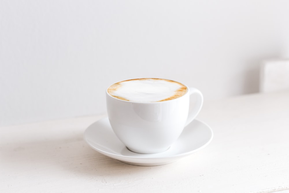 white ceramic cup and saucer