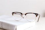 clear eyeglasses on book