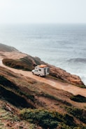 camper trailer on cliff near sea