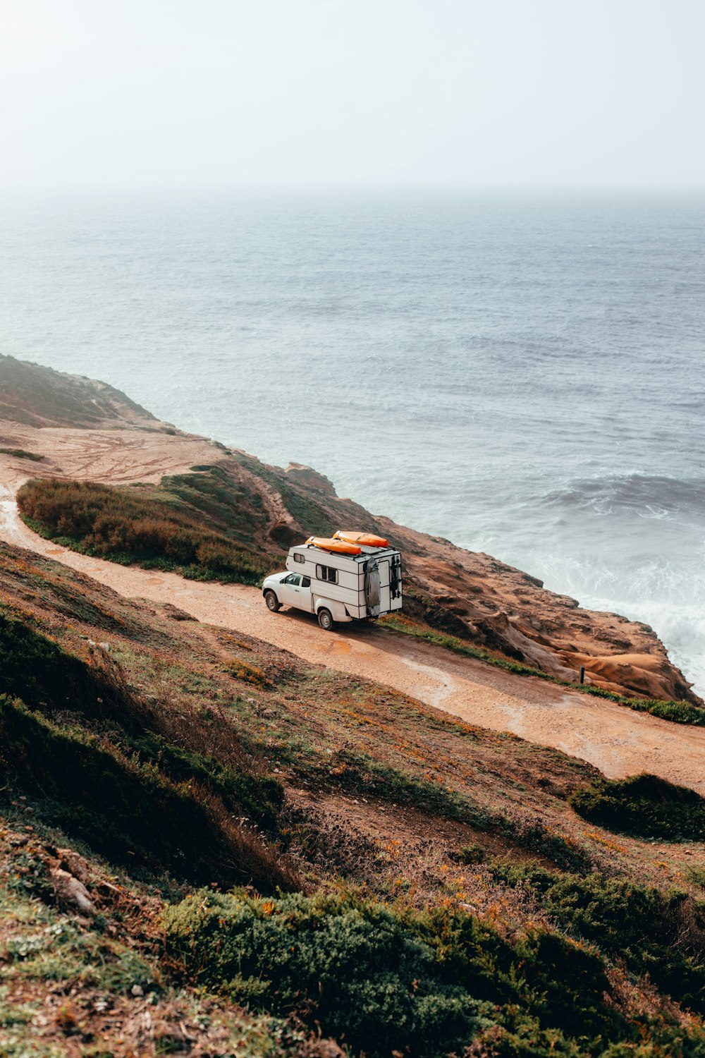 camper trailer on cliff near sea