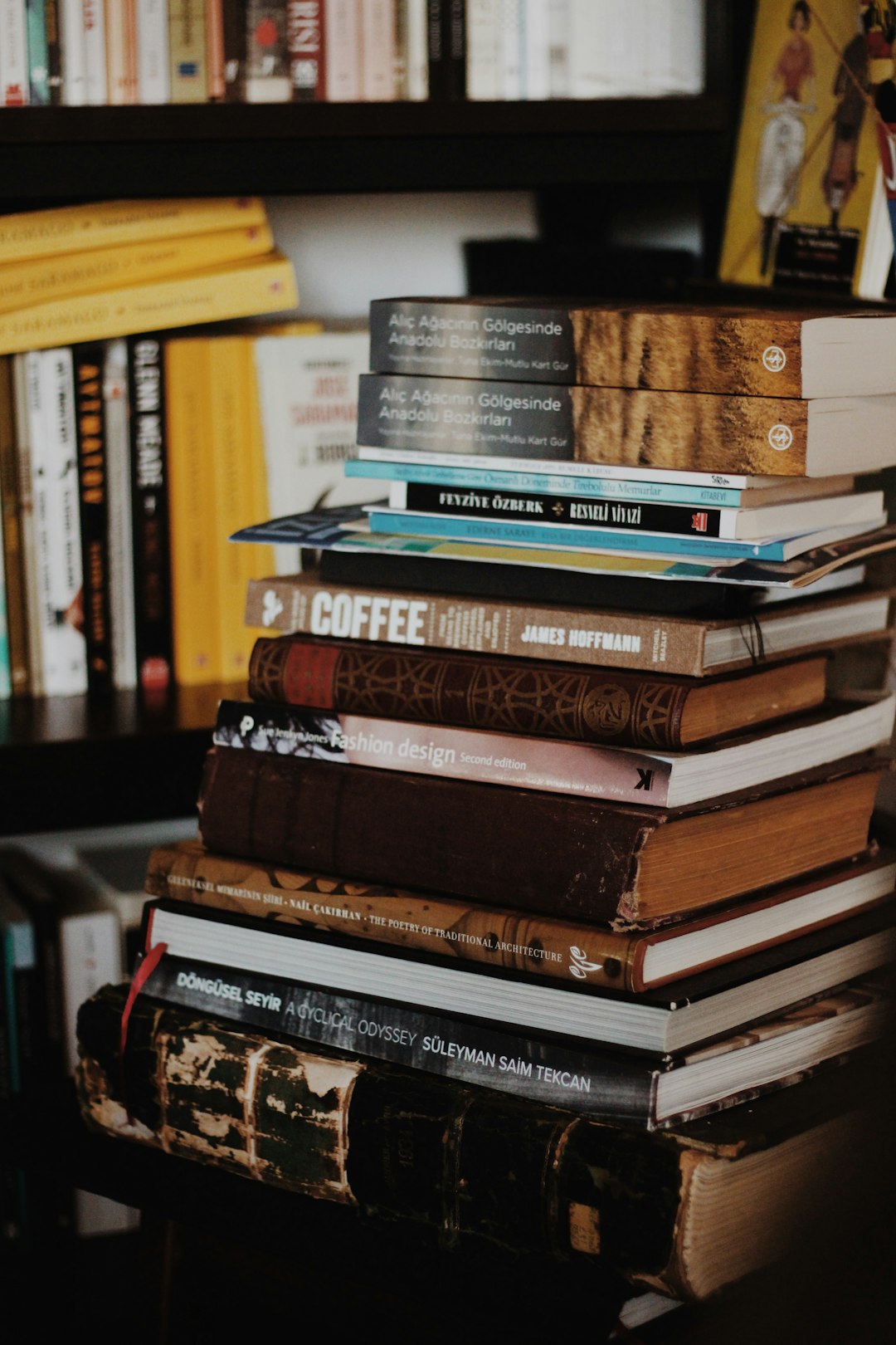 assorted title books neat black wooden book shelf