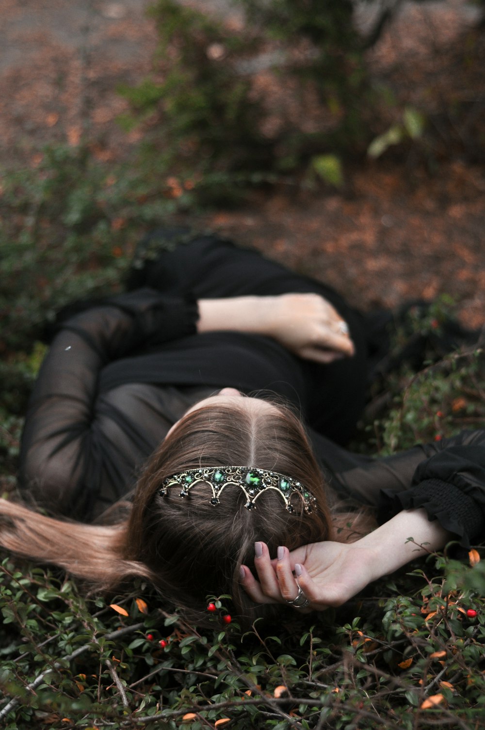 woman lying on grass field