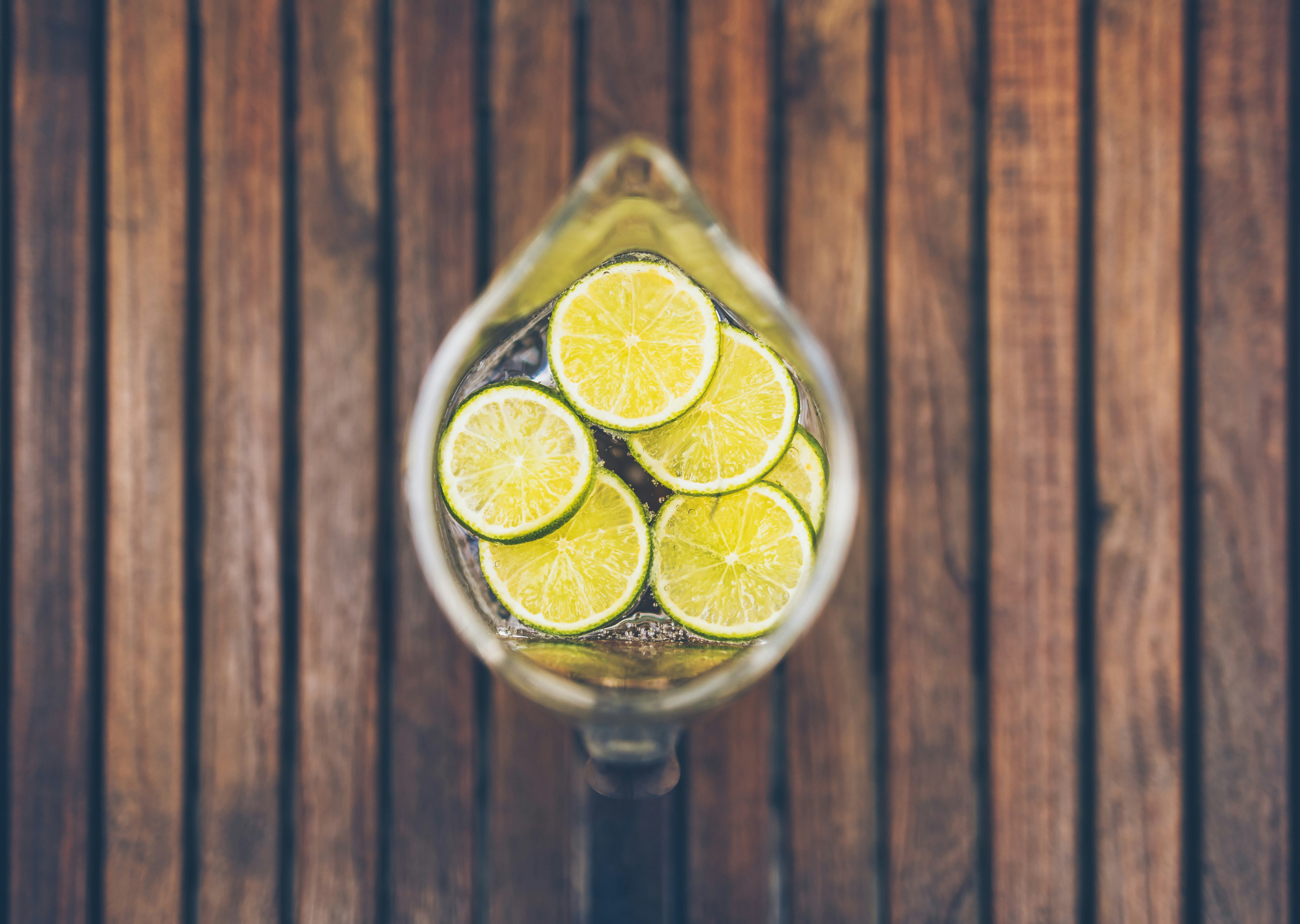 sliced lime in clear glass pitcher