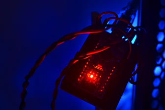 Close-up of a sleek digital circuit board glowing with blue light