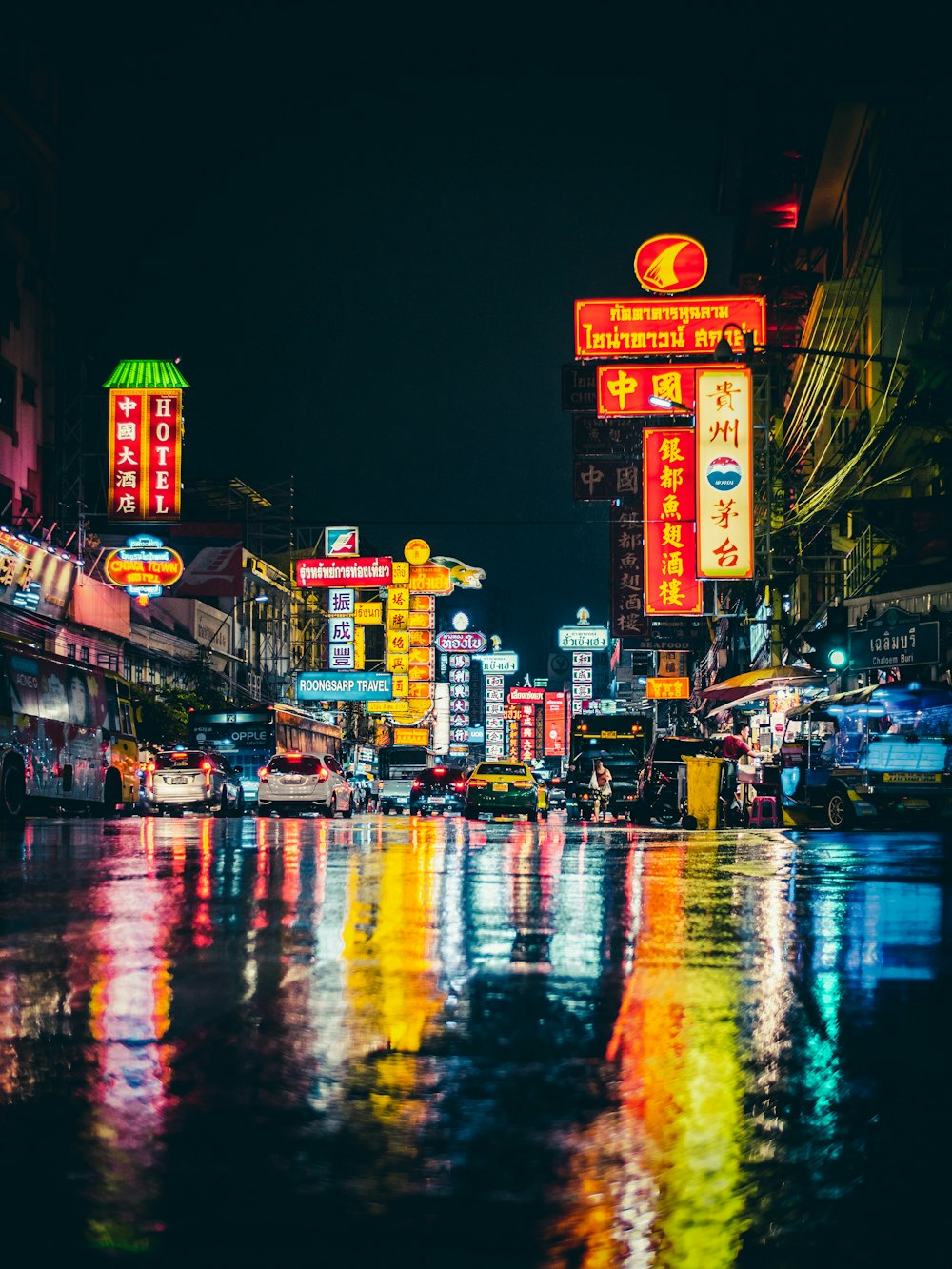 cars parked on wet sidewalk \