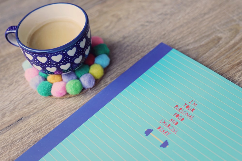 blue ceramic cup on tabletop